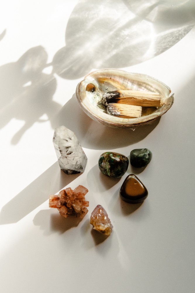 Crystals sitting with smudging bowl.