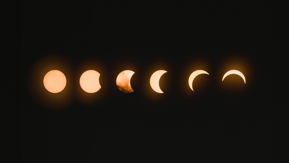 The different moon phases all beside one another.