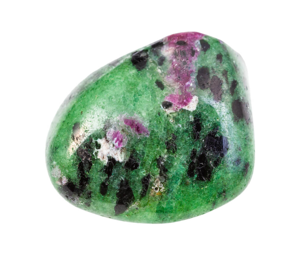 Green and purple stone with black spots